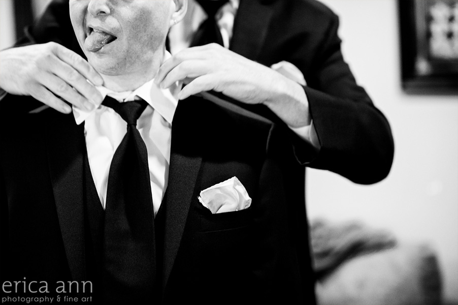 Black and white groom getting ready
