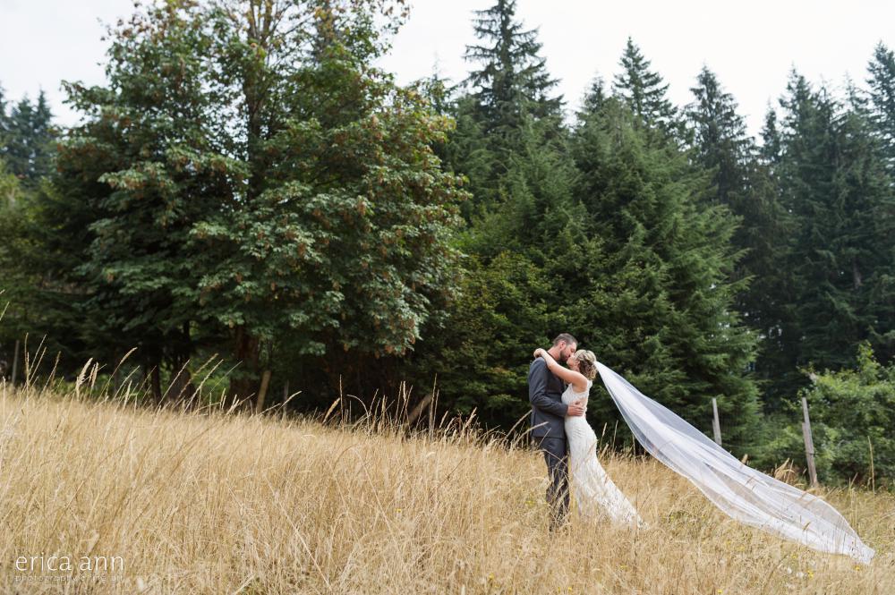 bride and groom hay field