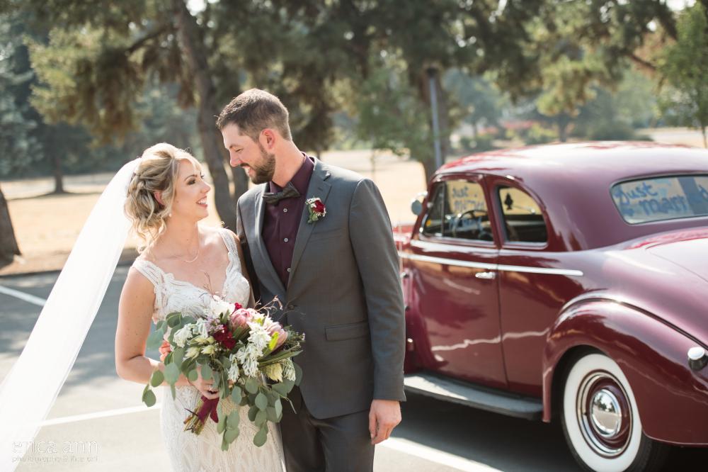 bride and groom classic getaway car